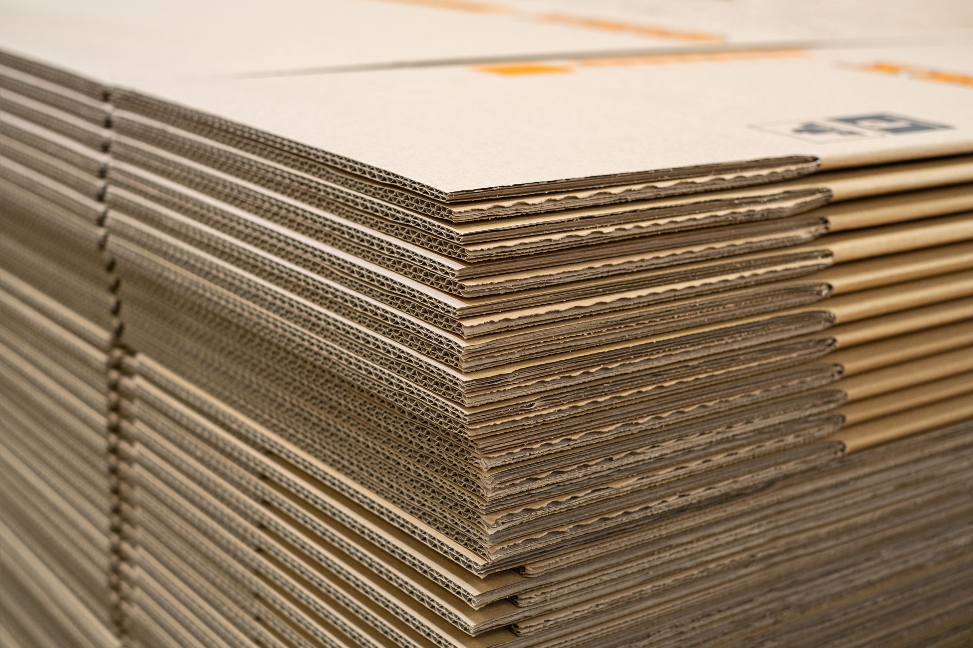 Stack of new Disassembled condition packaging corrugated carboard boxes. lot of cardboard packaging. not folded. Production distribution concept.